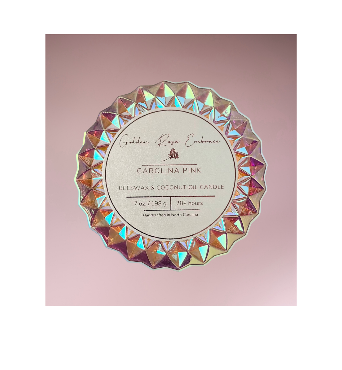 Carolina Pink 7 oz beeswax candles, pink iridescent posh glass jar, woodwick candles, aroma of rosy pink peony, green foliage, and a touch of spice, top view.