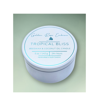 Tropical Bliss 5oz Beeswax Candle. 
White Tin. Woodwick.
Notes of Mango, Orange, Pineapple, Blood Orange, Peach, Banana, Apple, Coconut, Tonka, Vanilla, Green, Rose, Jasmine, Violet, Lavender, Resin, Musk, Paprika, Red Pepper, Pimento Leaf, Black Tea, Teakwood, Vetiver, and Golden Amber. A heavenly tropical aroma of guava, passionfruit, mango, pineapple, and coconut. . Custom beeswax candle blended with organic coconut oil and nontoxic fragrances and essential oils.