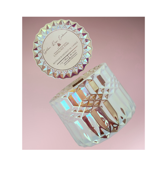 Carolina Pink 7 oz beeswax candles, pink iridescent posh glass jar, woodwick candles, aroma of rosy pink peony, green foliage, and a touch of spice, side view. 