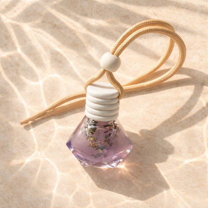 Car Diffusers. 8ML. Glass, wooden lid. Hangs from rearview mirror. Lavender Lea - a lavender meadow scent infused with Lemon, Green, Herbal, Eucalyptus, Lavender, Geranium, Rose, Violet, Tonka Bean, Musk, Citrus, Bergamot.