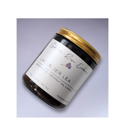 Lavender Lea 7oz Beeswax Candle. Amber glass jar. Gold metal lid. Cotton wick. 
A warm, soothing aroma of a lavender meadow with rows of lavender flowers drenched in the morning sunlight gently shifting in the breeze. 