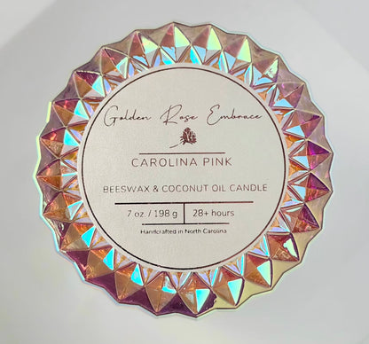 Carolina Pink 7 oz beeswax candles, pink iridescent posh glass jar, woodwick candles, aroma of rosy pink peony, green foliage, and a touch of spice, top view. 