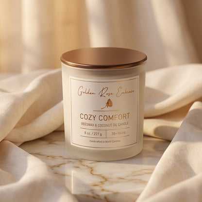 Cozy Comfort 8oz Beeswax Candle. Frosted glass jar, bronze metallic lid, and woodwick. 
Notes of Bergamot, Mahogany, and Musk. 
Create a warm and cozy atmosphere with the aroma of flannel, bergamot, mahogany, and musk. This fragrance will envelope you in comfort. 