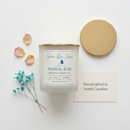Tropical Bliss 8oz Beeswax Candle. 
Frosted glass jar, Gold metallic lid. Woodwick. 
Notes of Mango, Orange, Pineapple, Blood Orange, Peach, Banana, Apple, Coconut, Tonka, Vanilla, Green, Rose, Jasmine, Violet, Lavender, Resin, Musk, Paprika, Red Pepper, Pimento Leaf, Black Tea, Teakwood, Vetiver, and Golden Amber. A heavenly tropical aroma of guava, passionfruit, mango, pineapple, and coconut. Custom beeswax candle blended with organic coconut oil and nontoxic fragrances and essential oils.